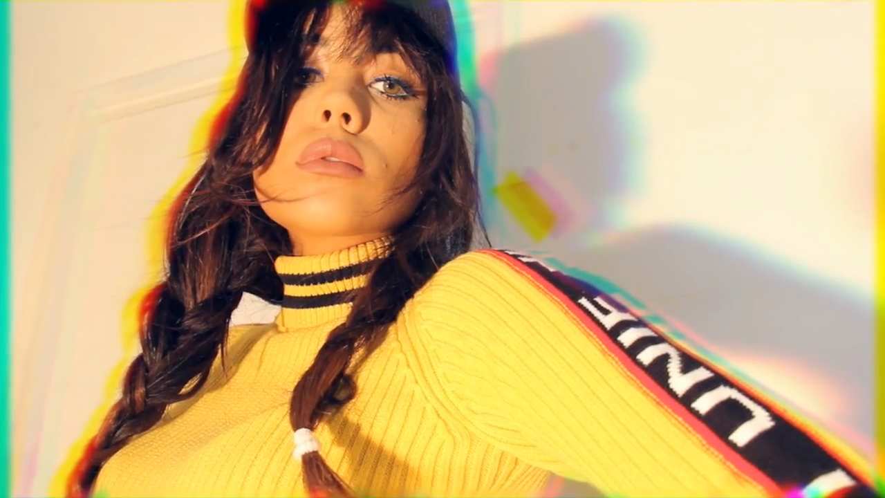 a girl in a ribbed top with a striped turtleneck